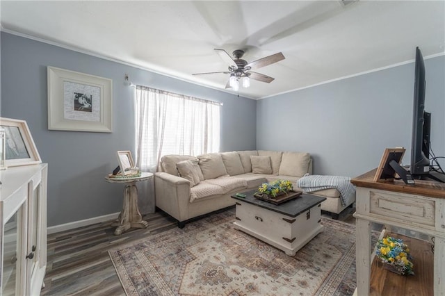 living room featuring ceiling fan, dark hardwood / wood-style flooring, and crown molding