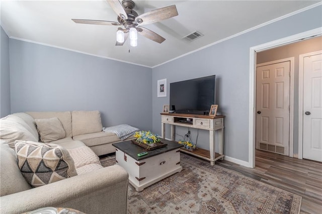 living room with ceiling fan, ornamental molding, and wood-type flooring