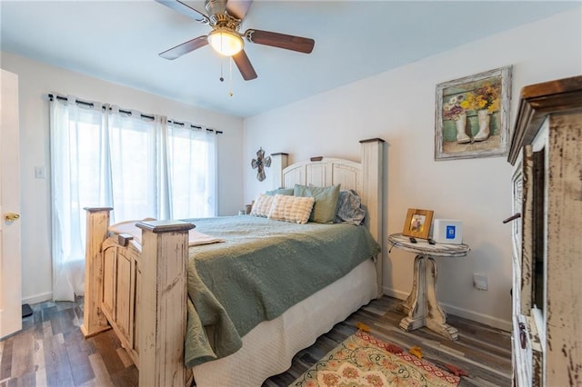 bedroom with dark wood-type flooring and ceiling fan