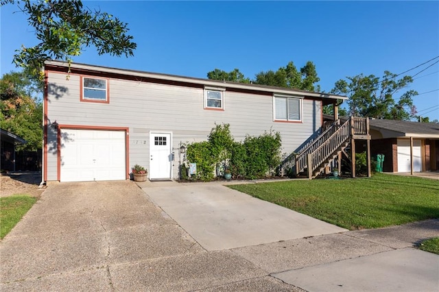 view of front of property with a garage and a front yard