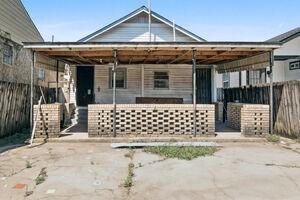 back of property featuring a carport