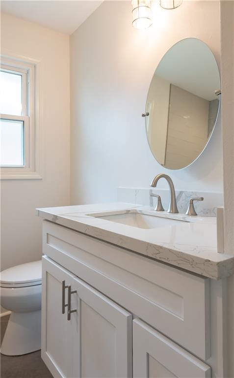 bathroom with oversized vanity and toilet