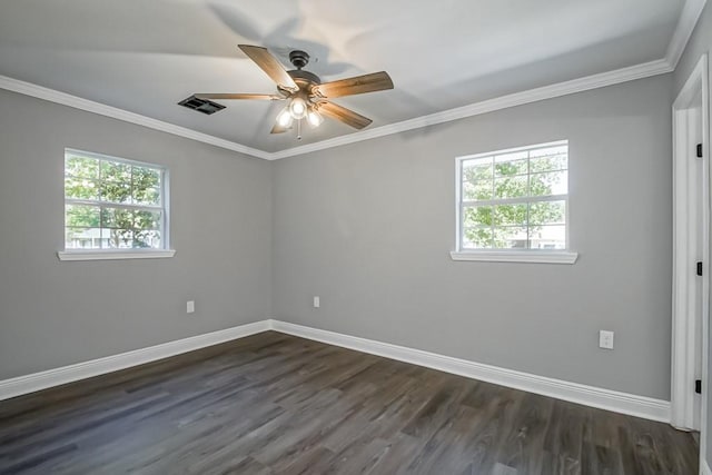 empty room with dark hardwood / wood-style flooring, ornamental molding, and ceiling fan