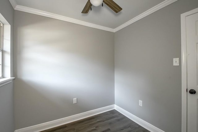 spare room featuring dark hardwood / wood-style flooring, ceiling fan, and crown molding