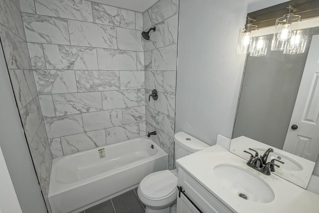 full bathroom with tile flooring, tiled shower / bath combo, vanity, and toilet