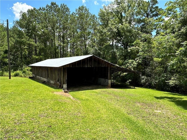 view of outdoor structure with a lawn