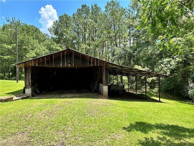 surrounding community featuring a lawn and a carport