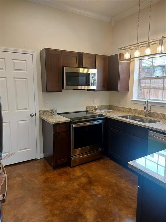 kitchen with dark brown cabinetry, light stone counters, stainless steel appliances, ornamental molding, and sink