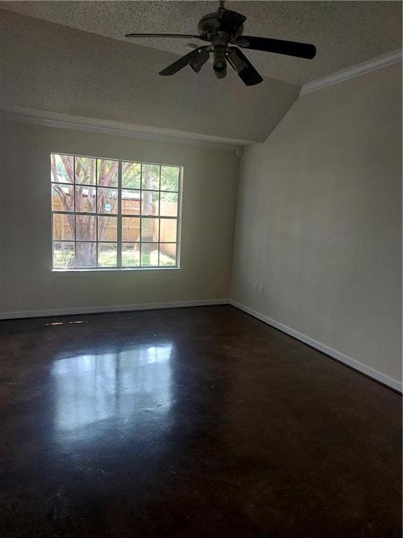 empty room featuring crown molding, a textured ceiling, ceiling fan, and vaulted ceiling