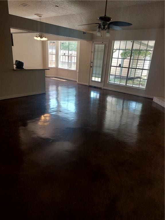 spare room with a textured ceiling and ceiling fan