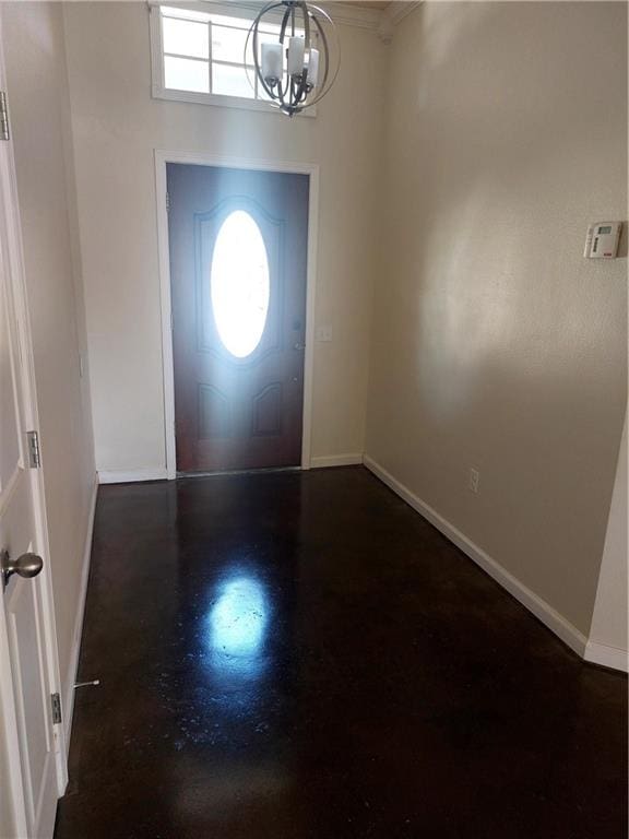 foyer entrance featuring a notable chandelier