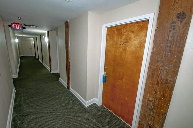 hall with dark carpet