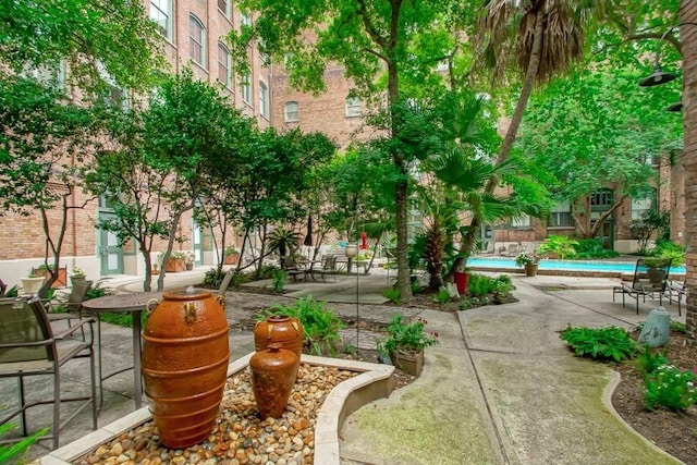 view of property's community featuring a patio area