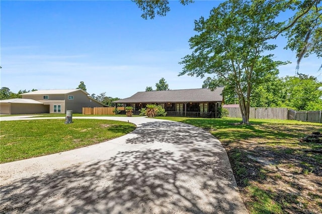 ranch-style home with a front yard