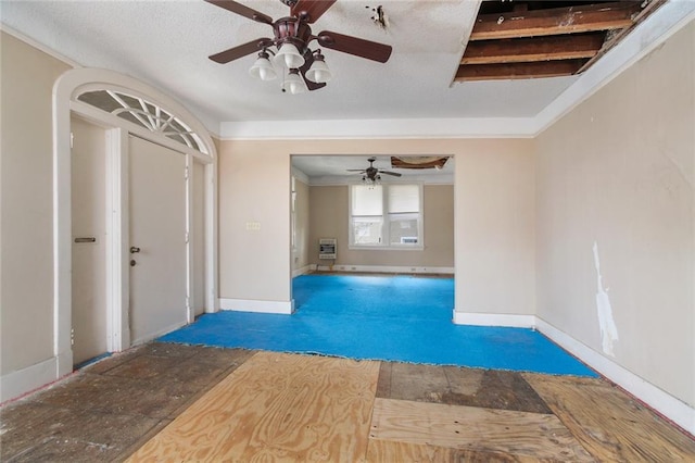 unfurnished living room with ceiling fan and carpet floors