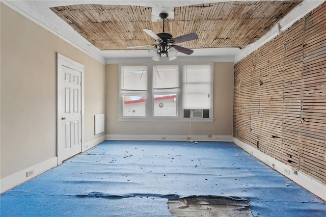 empty room with cooling unit, wood ceiling, baseboards, and ceiling fan