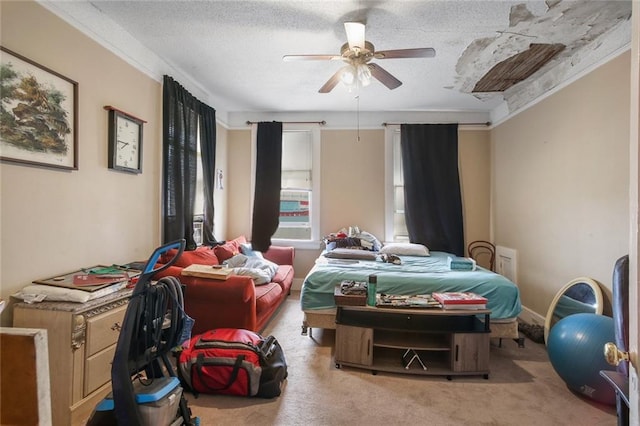 bedroom with ornamental molding, a textured ceiling, ceiling fan, and carpet floors