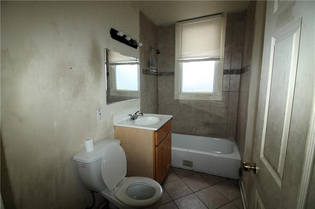 full bathroom with tiled shower / bath, tile flooring, oversized vanity, and toilet