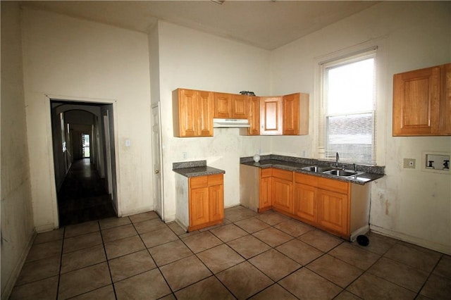 kitchen featuring sink and tile floors