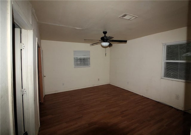 unfurnished room featuring dark hardwood / wood-style floors and ceiling fan