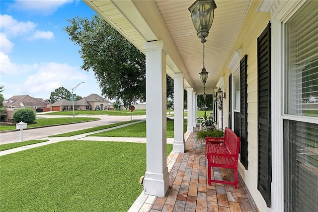 view of yard with covered porch