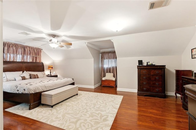 bedroom featuring hardwood / wood-style floors, vaulted ceiling, and ceiling fan