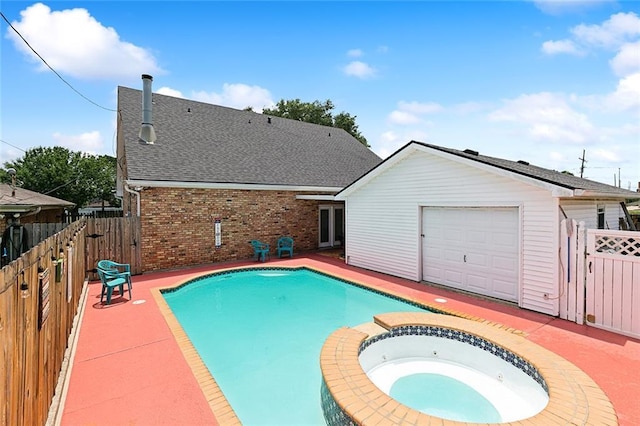 view of swimming pool featuring an in ground hot tub and a patio area