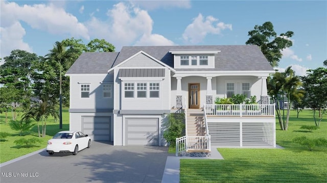 view of front of house featuring a front lawn, a garage, and covered porch