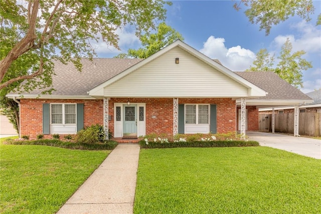 ranch-style house featuring a front yard and a carport