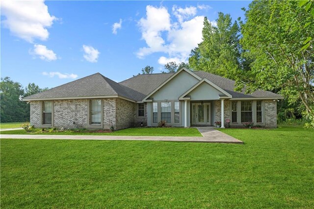 ranch-style house featuring a front lawn