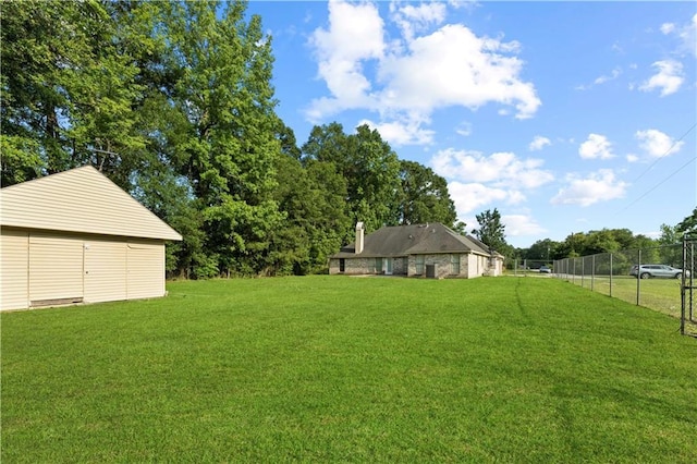 view of yard with fence