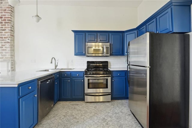 kitchen with stainless steel appliances and blue cabinets