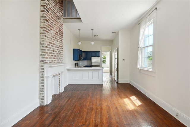 unfurnished living room with dark hardwood / wood-style flooring