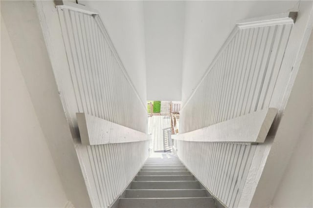 stairway with a towering ceiling