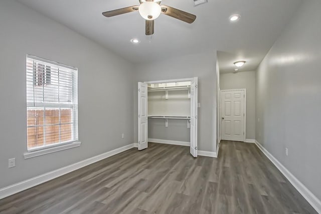 unfurnished bedroom featuring baseboards, dark wood finished floors, and recessed lighting