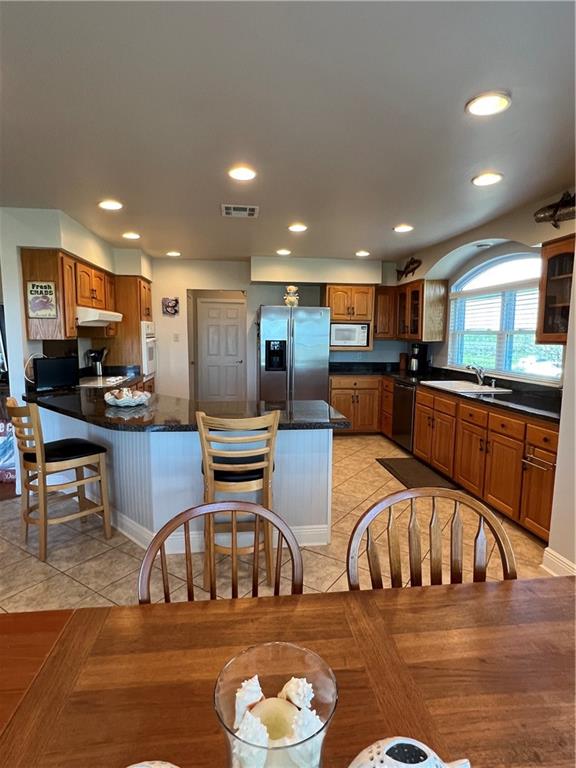 dining room with sink and light tile floors