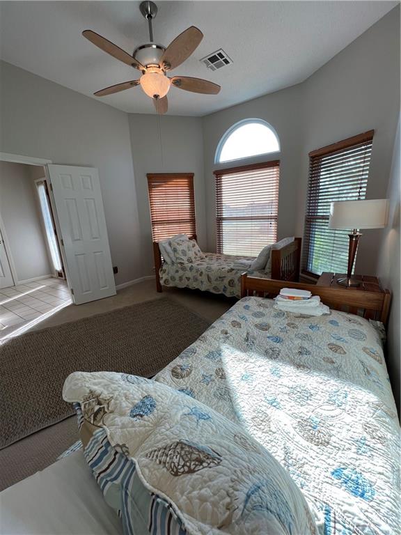 carpeted bedroom featuring ceiling fan