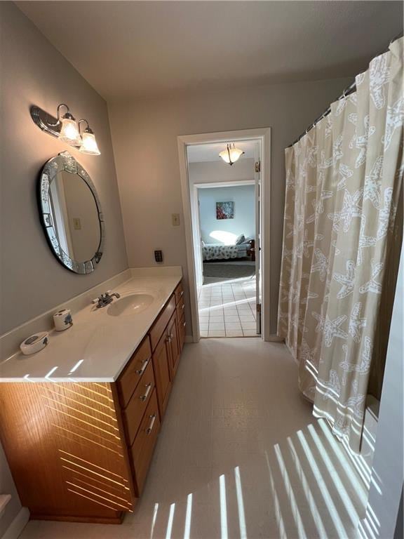 bathroom featuring tile flooring and vanity