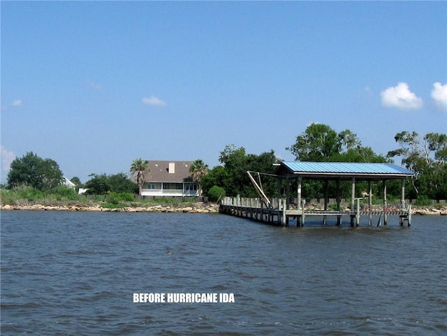 view of water feature with a dock