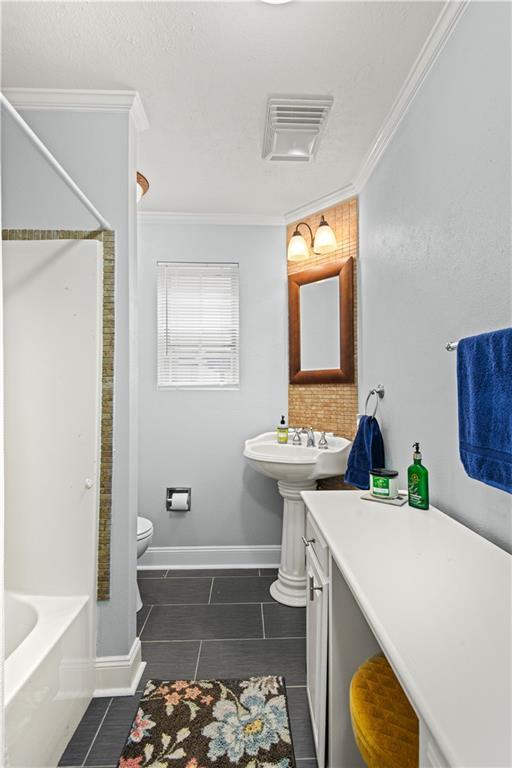 full bath with toilet, visible vents, walk in shower, tile patterned flooring, and crown molding
