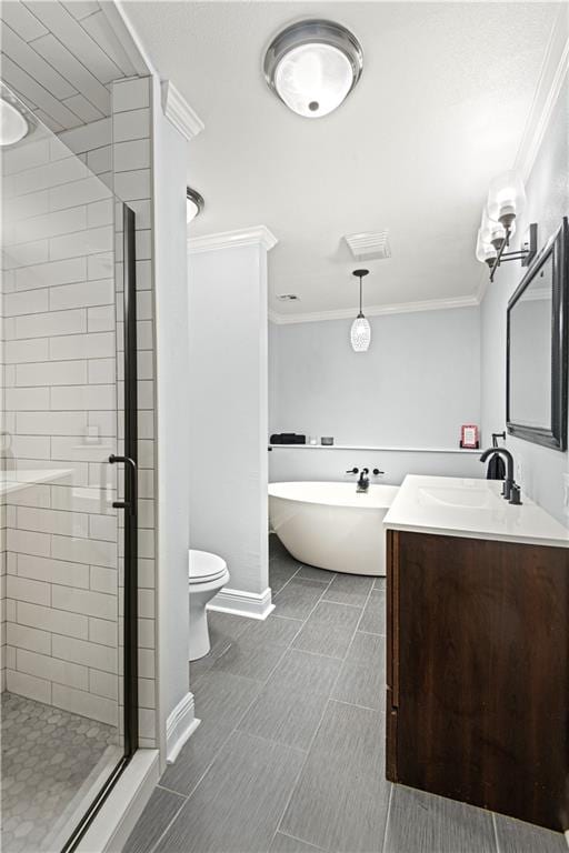 bathroom featuring toilet, tile floors, crown molding, a shower with door, and vanity