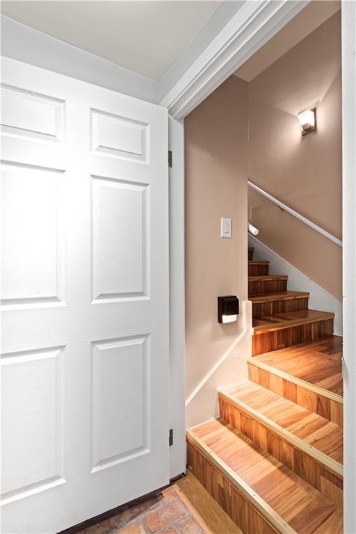 stairs featuring brick floor