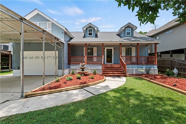 view of front of house with driveway, a shingled roof, fence, a porch, and a front yard