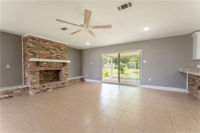 unfurnished living room featuring ceiling fan, a fireplace, and light tile patterned floors