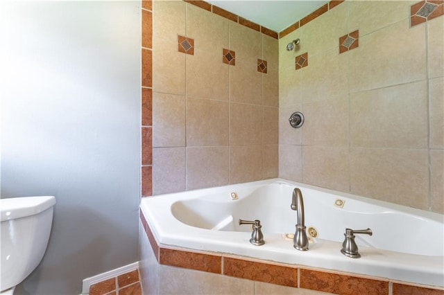 bathroom featuring a relaxing tiled tub and toilet