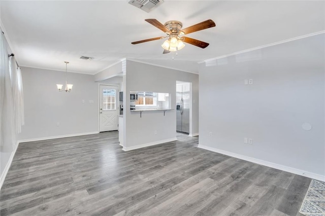 unfurnished living room with ornamental molding, hardwood / wood-style flooring, and ceiling fan with notable chandelier