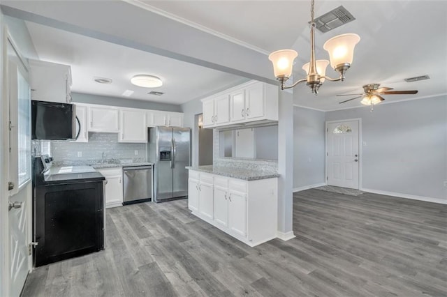 kitchen featuring light hardwood / wood-style floors, white cabinets, ceiling fan with notable chandelier, and stainless steel appliances