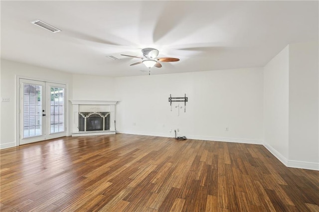 205 Stonehaven Dr, Belle Chasse, LA 70037 - unfurnished living room with wood-type flooring, french doors, and ceiling fan