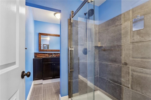 205 Stonehaven Dr, Belle Chasse, LA 70037 - bathroom featuring tile patterned flooring, vanity, and an enclosed shower