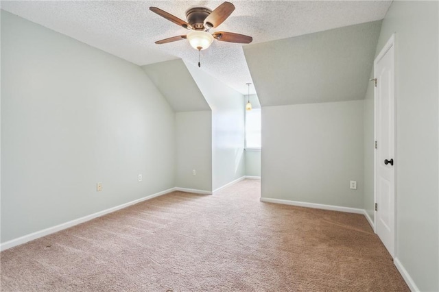 205 Stonehaven Dr, Belle Chasse, LA 70037 - additional living space with a textured ceiling, light carpet, ceiling fan, and vaulted ceiling